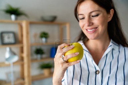 Photo for Pregnancy, healthy food and people concept Happy young pregnant woman eating apple. healthy food. - Royalty Free Image