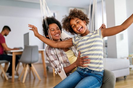 Photo for Togetherness family concept. Happy african american mother and daughter spendig fun time together at home - Royalty Free Image
