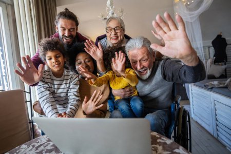 Photo for Extended multiethnic family together at home during video call. Modern technology, visual virtual on-line meeting using pc internet connection and webcam concept. - Royalty Free Image