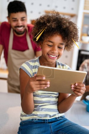 Photo for African american preteen girl using digital tablet computer playing game, learning online. People technology communication concept - Royalty Free Image