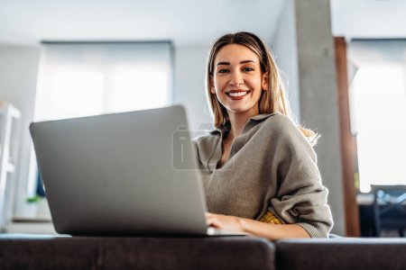 Photo for Young success woman freelancer is working on a new project on laptop. Technology work business people concept. - Royalty Free Image