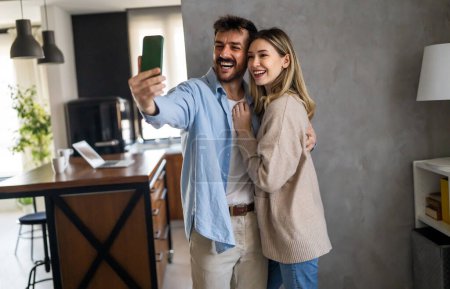 Photo for Capturing happy moments together. Happy young loving couple making selfie and smiling. Social media concept. - Royalty Free Image