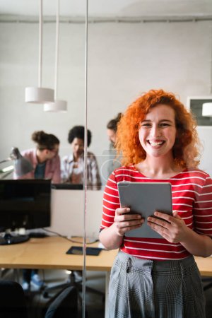 Photo for Portrait of young happy success woman working in a busy modern workplace, Startup coworker office happiness concept. - Royalty Free Image