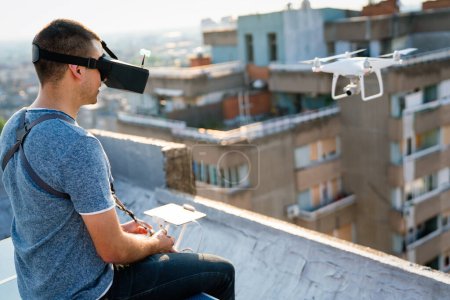Photo for Man operating a drone with remote control outdoor - Royalty Free Image