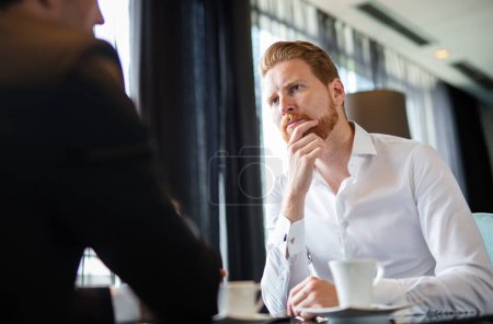 Photo for Business executive men, colleagues discussing work at meeting during coffee break. Business lunch, business people concept - Royalty Free Image