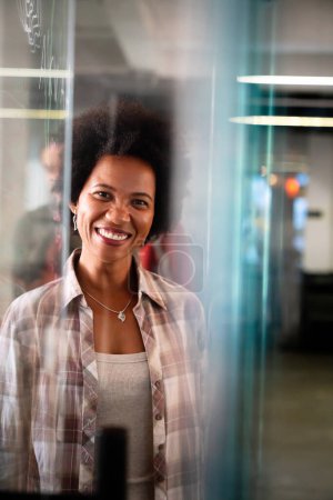 Photo for Portrait of young happy success african american woman working in a busy modern workplace, Startup coworker office happiness concept. - Royalty Free Image