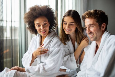 Photo for Free relationship concept, swinger clubs. Happy people enjoying relax weekend together in spa hotel. Polyamory concept - Royalty Free Image