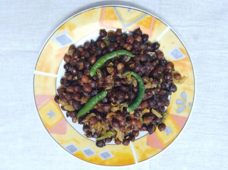 Photo for A dish called Chola Boot masala with Green Chilli in a Plate - Royalty Free Image