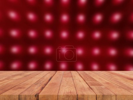 perspective wooden board over blurred red electric light background
