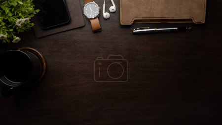 Photo for Top view of wooden desk with cup of coffee, notebook and glasses. Copy space for your text. - Royalty Free Image