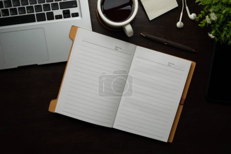 Photo for Top view of blank notepad, pen, cup of coffee, houseplant and keyboard on table. - Royalty Free Image