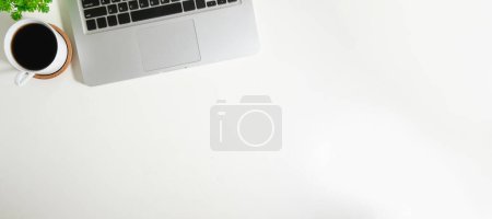Photo for Laptop computer and cup of coffee on white background. Top view with copy space for your text - Royalty Free Image