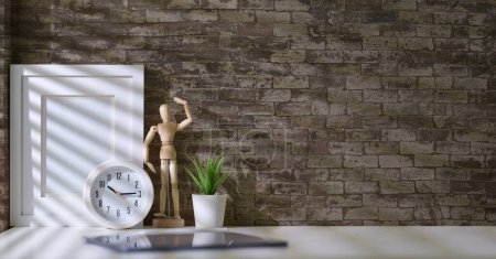Photo for Blank picture frame mockup, clock, digital tablet and plant on white table against brick wall with copy space. - Royalty Free Image