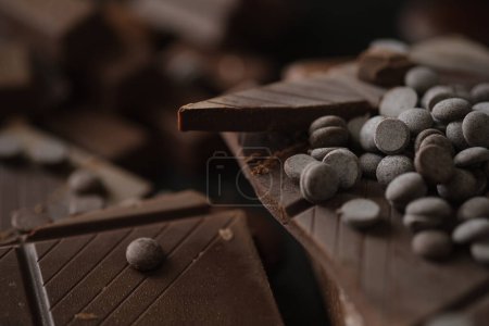 Photo for Closeup view of pieces of chocolate bar with chocolate chips. - Royalty Free Image