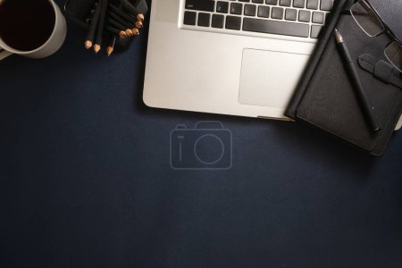 Photo for Office desk with laptop computer,notebook and cup of coffee.Top view with copy space for your text. - Royalty Free Image