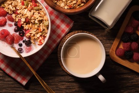 Photo for A cup of milk with bowl of oat granola with fresh milk and berries for healthy breakfast. Vegeterian, dieting and weight loss concept. - Royalty Free Image