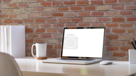 Photo for Comfortable home office. Laptop computer, stationery and potted plant on white table. - Royalty Free Image