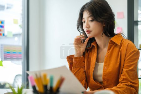 Photo for Young stylish woman working on design project at modern office. - Royalty Free Image