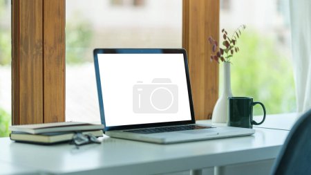 Photo for Home office desk with computer laptop, coffee cup and houseplant on wood table. - Royalty Free Image