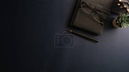 Photo for Top view of working desk with notebook, pen, potted plant and coffee cup. Copy space for your text. - Royalty Free Image