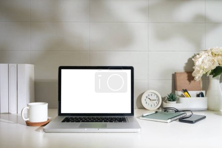 Photo for Home office desk with computer laptop, coffee cup and houseplant on wood table. - Royalty Free Image