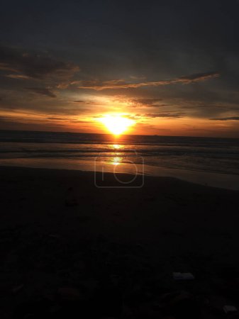 Photo for Vertical photo of sunset on the beach - Royalty Free Image