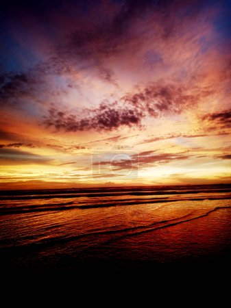 Photo for Vertical photo of sunset on the beach - Royalty Free Image