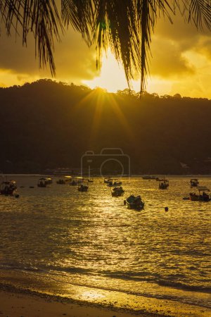 Terengganu, Malaysia - March 16, 2023 Golden sunrise in Perhentian Island.