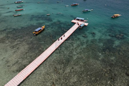 Aerial view of natural clear blue sea with sea floating bridge and boat, Perhentian Kecil Island., Beautiful destination place Asia, Summer vacation travel trip