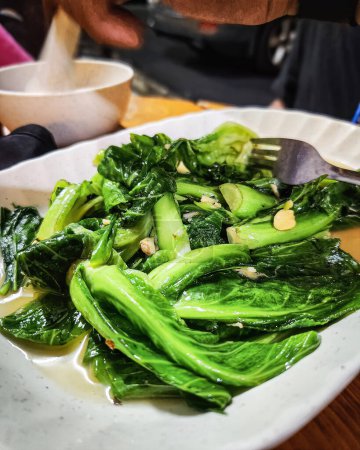 Green vegetables cooked with oyster sauce. Chinese kale fried in oyster sauce