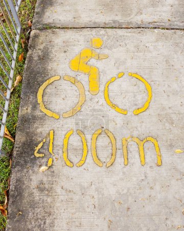 Photo for 400m bike lane printed on the concrete floor at the park. - Royalty Free Image