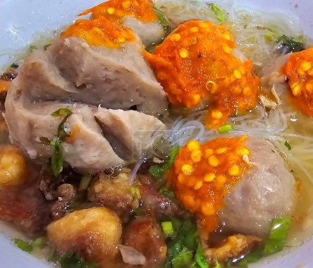 Bakso, indonesian meatball style served with beef broth soup and noodle springkled with fried onion and spring onion coupled with chili sauce on the top, very famous Asian street food