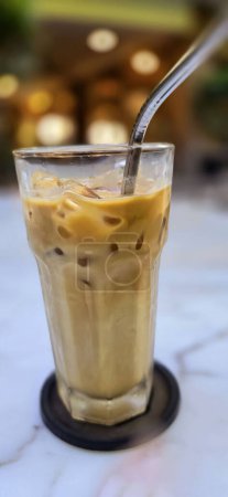 Photo for Fresh iced coffee in glass with frothy cream for your design, Food concept in style, copy space for content creation - Royalty Free Image