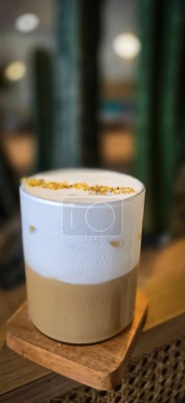 Photo for Fresh iced coffee in glass with frothy cream for your design, Food concept in style, copy space for content creation - Royalty Free Image
