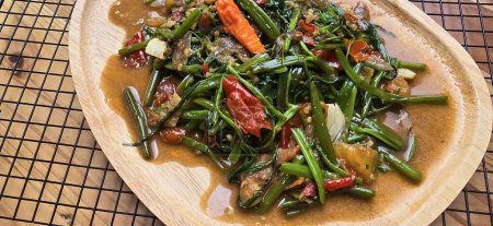 vegetable stir fried water spinach on chinese style cooking served on plate, sauteed water spinach one of the typical foods of Asian origin, good for cooking recipes ideas