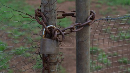Rusted lock securing serene boundary