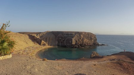 Lanzarotes serene beach paradise, cliffs guard tranquil turquoise waters