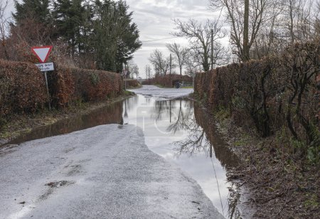 Flooded lane due to excess rainfall in Winter in the South of England