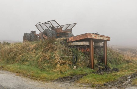 An acient tractor and trailer adapted to move peat in the Bogs of Moycullen in Ireland