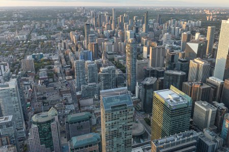 Photo for Toronto, On, Canada - October 7, 2019: View at the center of Toronto during sunset time. Photo taken from the top of CN Tower. - Royalty Free Image