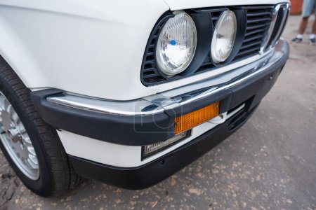 Photo for Riga, Latvia - April 1, 2024: Close up of white classic BMW E30 car from side. - Royalty Free Image