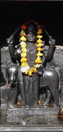 Photo for Hindu statue with flowers in Asia - Royalty Free Image
