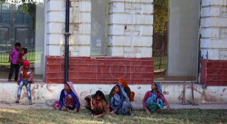 Photo for DELHI INDIA - 02 12 2023: Portrait of Indian women posing in a park of red fort of New Delhi - Royalty Free Image