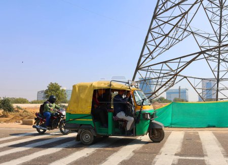 Photo for DELHI INDIA - 02 11 2023: An auto rickshaw is a motorized version of the pulled rickshaw or cycle rickshaw. Most have three wheels and do not tilt. - Royalty Free Image