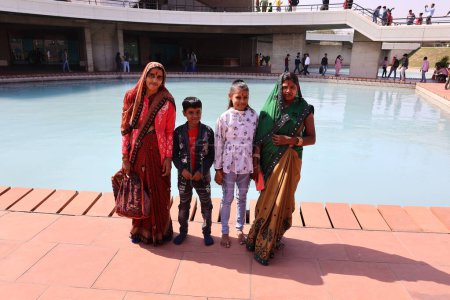 Photo for DELHI INDIA - 02 12 2023: Family portrait of Indian people posing in a park - Royalty Free Image