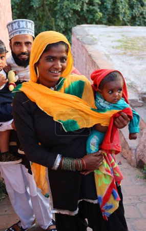 Photo for JODHPUR RAJASTHAN INDIA - 02 13 2023: Portrait of indians mother and baby. Indian people are the citizens and nationals of the Republic of India. In 2022, the population of India stood at 1.4 billion - Royalty Free Image