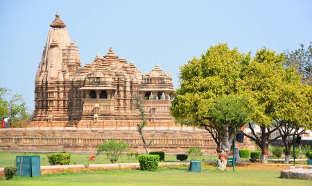 Photo for KHAJURAHO INDIA - 03 03 2023: Khajuraho Group of Monuments are a group of Hindu and Jain temples famous for their nagara-style architectural symbolism and a few erotic sculptures - Royalty Free Image