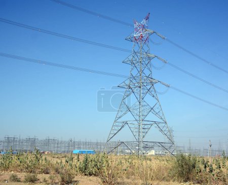 Photo for RURAL RAJASTHAN INDIA - 02 23 2023: View of electricity pylon along the paddy fields - Royalty Free Image