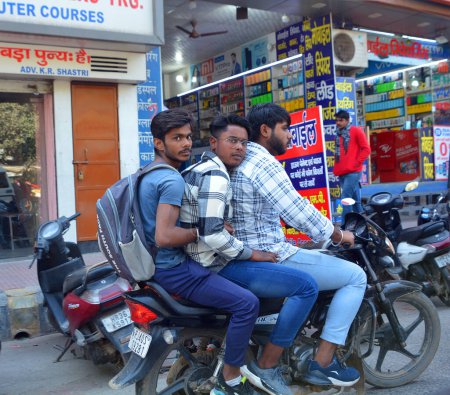 Photo for BIKANER RAJASTHAN INDIA - 02 16 2023: Unidentified men drive motorcycle with goods on a road - Royalty Free Image
