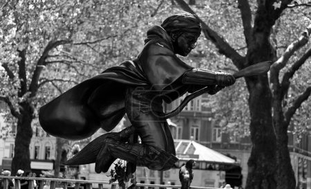 Photo for LONDON UNITED KINGDOM 06 19 2023: Harry Potter statue sculpture depicts Harry, flying on his broom thingy.A fun stop on the movie statue trail around Leicester square - Royalty Free Image